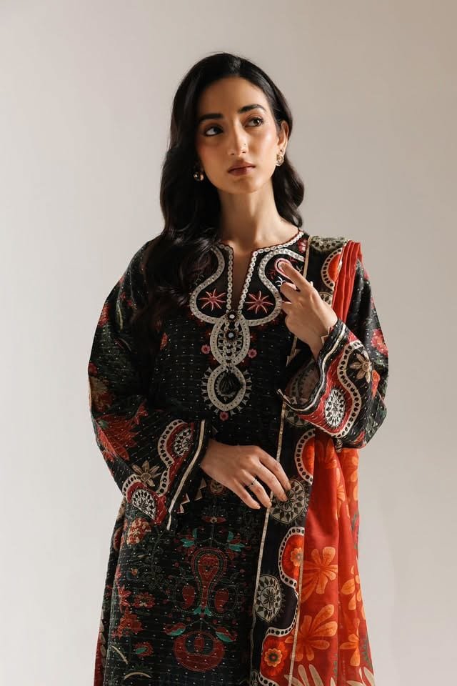 Anaya — ink-black embroidered lawn with a burnt-orange printed silk dupatta